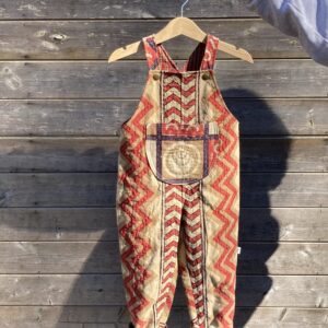 Handmade kids dungarees in upcycled cotton bedspread with big front pocket and adjustable bib straps.