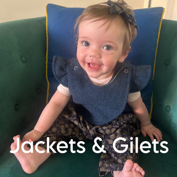 A smiling baby wearing a blue cross front gilet and the caption "Jackets and Gilets"